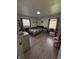Comfortable bedroom with a view, hardwood floors, and playful decor at 6126 Regina Cir, Indianapolis, IN 46224