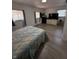 Cozy bedroom featuring hardwood floors and ample natural light at 6126 Regina Cir, Indianapolis, IN 46224