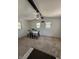 Bright dining room with carpet floors, a ceiling fan, and a table with seating at 6126 Regina Cir, Indianapolis, IN 46224
