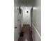 Bright hallway with hardwood floors and classic paneled walls at 6126 Regina Cir, Indianapolis, IN 46224