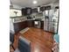 Well-equipped kitchen featuring stainless steel appliances, wood cabinets, and tile backsplash at 6126 Regina Cir, Indianapolis, IN 46224