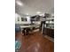 Kitchen featuring an island with seating, wood cabinets, and stainless steel appliances at 6126 Regina Cir, Indianapolis, IN 46224