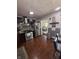 Kitchen featuring wood cabinets, stainless steel appliances, and a view into the dining area at 6126 Regina Cir, Indianapolis, IN 46224