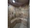 Tiled shower with multiple shower heads and built-in seating at 6126 Regina Cir, Indianapolis, IN 46224