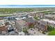 Aerial view showcasing the buildings and neighborhood with lush green trees at 630 N College Ave # 105, Indianapolis, IN 46204