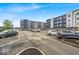 Modern apartment complex with parking and well-maintained landscaping, showcasing a contemporary lifestyle at 630 N College Ave # 105, Indianapolis, IN 46204