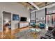 Bright and airy living room with hardwood floors and modern decor opens to the bedroom at 630 N College Ave # 105, Indianapolis, IN 46204