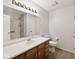 Bright bathroom featuring a large mirror, single sink vanity, toilet, and modern shower at 6406 Longhorn Ct, Indianapolis, IN 46237
