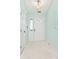 Bright entryway with white tiled floor and a charming light fixture at 6406 Longhorn Ct, Indianapolis, IN 46237