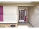 Covered front porch featuring a decorative front door with glass panels at 6406 Longhorn Ct, Indianapolis, IN 46237