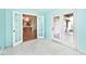 A bright home office with an open view of a modern kitchen, French doors to the living room, and a door to the patio at 6406 Longhorn Ct, Indianapolis, IN 46237