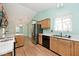 Bright kitchen with wooden cabinets and modern appliances at 6406 Longhorn Ct, Indianapolis, IN 46237