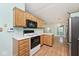 Well-equipped kitchen with wooden cabinets and modern appliances at 6406 Longhorn Ct, Indianapolis, IN 46237