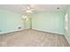 Bright living room featuring neutral carpet, enhanced by natural light at 6406 Longhorn Ct, Indianapolis, IN 46237