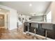 Kitchen bar area featuring three stools and an open view of the home at 6579 Aster Dr, Pendleton, IN 46064