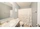 Bathroom offers a vanity with sink, toilet, and shower/tub combo with decorative curtain at 6579 Aster Dr, Pendleton, IN 46064