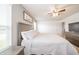 Bedroom with a ceiling fan, soft gray walls, and a large bed with white bedding at 6579 Aster Dr, Pendleton, IN 46064