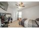 This bedroom features a ceiling fan, a window for natural light, and a bed for relaxation at 6579 Aster Dr, Pendleton, IN 46064