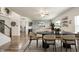 Open-concept dining room featuring a round table, stylish chairs, and wood flooring at 6579 Aster Dr, Pendleton, IN 46064