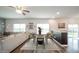 Dining area with a round table, modern chairs, and seamless flow into the living room space at 6579 Aster Dr, Pendleton, IN 46064