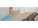 Home exercise room featuring a Flybird bench, exercise mat, and neutral carpet at 6579 Aster Dr, Pendleton, IN 46064