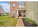 Inviting front entrance with landscaped garden, a rocking chair, and a welcome sign at 6579 Aster Dr, Pendleton, IN 46064