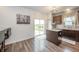 Kitchen featuring dark wood cabinetry, granite countertops, and a glass sliding door at 6579 Aster Dr, Pendleton, IN 46064