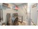 This laundry room features modern washer, storage shelves, and utility hook-ups at 6579 Aster Dr, Pendleton, IN 46064