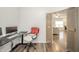Office space featuring an ergonomic chair, wooden sliding barn doors, and wood flooring at 6579 Aster Dr, Pendleton, IN 46064