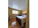 Bedroom with hardwood floors, a large window, and a comfortable bed, offering a relaxing and private space at 6723 Silver Tree Dr, Indianapolis, IN 46236
