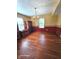 Dining room with wood floors, decorative trim, a vintage chandelier, and natural light from two windows at 6723 Silver Tree Dr, Indianapolis, IN 46236