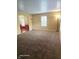 Spacious living room with carpet, neutral walls, large windows, and decorative floor lamps for ample lighting at 6723 Silver Tree Dr, Indianapolis, IN 46236