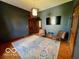 Bedroom showcasing hardwood floors, chairs and flat screen TV at 675 W Morgan St, Martinsville, IN 46151