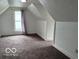 Cozy bedroom features natural light, carpet floors and ample headspace at 675 W Morgan St, Martinsville, IN 46151