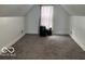 Bedroom with carpet floors, window, and ample headspace at 675 W Morgan St, Martinsville, IN 46151