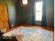 Well-lit bedroom featuring hardwood floors and large window at 675 W Morgan St, Martinsville, IN 46151