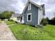 Well-manicured front yard featuring lush landscaping of a charming two-story house at 675 W Morgan St, Martinsville, IN 46151