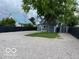 A blue house with a spacious gravel driveway and well-kept lawn at 675 W Morgan St, Martinsville, IN 46151