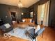 Bright and airy living room with wood floors, stylish furnishings, and a modern area rug at 675 W Morgan St, Martinsville, IN 46151