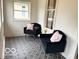 Cozy sun room with patterned tile flooring and comfortable seating at 675 W Morgan St, Martinsville, IN 46151