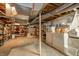 Spacious basement with laundry area, storage shelving, and ample room for activities at 6762 S State Road 67, Pendleton, IN 46064