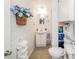 Cozy bathroom with a sink, toilet, decor, and plenty of cabinet storage at 6762 S State Road 67, Pendleton, IN 46064