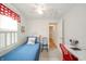 Charming bedroom with a cozy bed, bright lighting, and functional desk space at 6762 S State Road 67, Pendleton, IN 46064