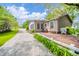 Charming single-story home with a large deck, lovely landscaping, and a gravel driveway at 6762 S State Road 67, Pendleton, IN 46064