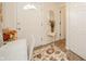 Inviting foyer featuring tile flooring, neutral walls, and a decorative rug at 6762 S State Road 67, Pendleton, IN 46064