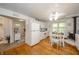 Clean white kitchen with modern appliances, a dining area, and a seamless flow into the rest of the home at 6762 S State Road 67, Pendleton, IN 46064