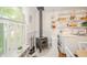Kitchen featuring a vintage stove, white cabinets, open shelving and plenty of light at 6762 S State Road 67, Pendleton, IN 46064