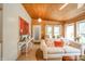 Inviting living room featuring comfortable seating, a wood ceiling, and natural light streaming through the windows at 6762 S State Road 67, Pendleton, IN 46064