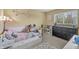 Bright bedroom with a trundle bed, modern furnishings, and a large window at 6833 Bluffridge Ln, Indianapolis, IN 46278