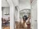 Inviting entryway with hardwood floors, arched doorways, and views into the dining and living areas at 6833 Bluffridge Ln, Indianapolis, IN 46278